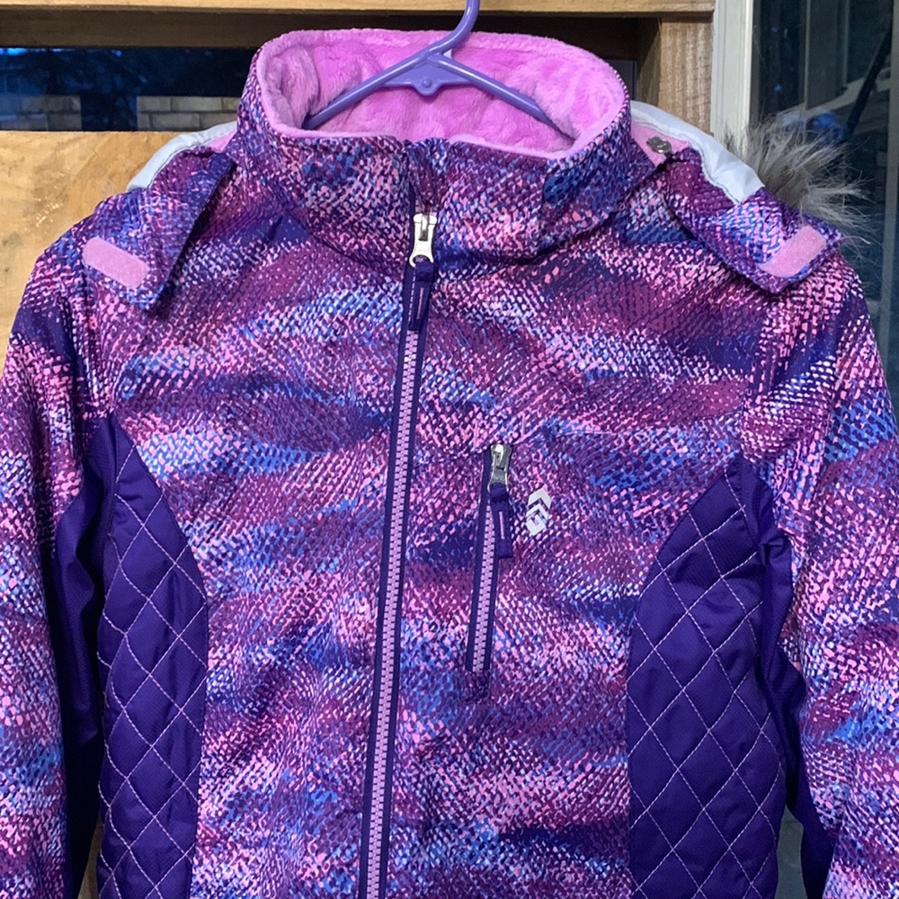 This is a girls, size 14, jacket. This jacket has adjustable sleeves, and a hood